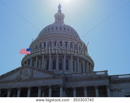 American Flag Half-mast On Top Of The Capitol.