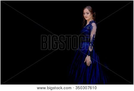 Close Up Portrait Of Beautiful Teen Girl In Beautiful Ultramarine Prom Dress Prom Dress. Black Backg