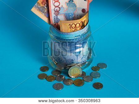 Tenge In A Glass Jar. Kazakhstan, Kz, Kzt. Banknote, Paper Currency, Coins, Bank. Salary, Credit, Sa