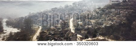 Early Morning Mist Rolling Down From The Hills On To The Rural Landscape Of Veliko Tarnovo, In Bulga