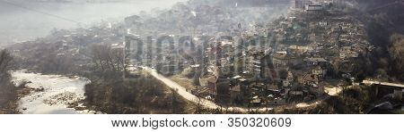 Early Morning Mist Rolling Down From The Hills On To The Rural Landscape Of Veliko Tarnovo, In Bulga