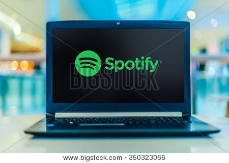 Laptop Computer Displaying Logo Of Spotify