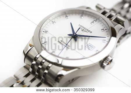 Saint-imier, Switzerland, 2.02.2020 - Longines Luxury Watch Gold Metal Bracelet Isolated White Table