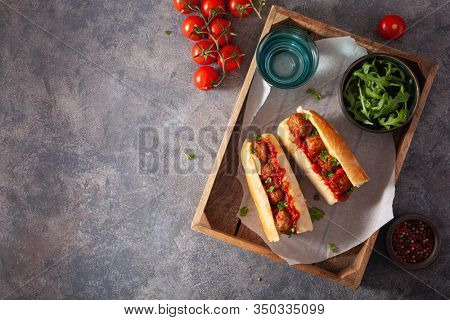 meatball sub sandwich with cheese and marinara tomato sauce. american italian fast food