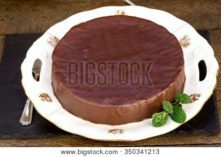 Creamy Chocolate Cake With Apricot Jam On Plate