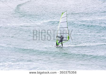 Windsurfing On The Background Of The Sea