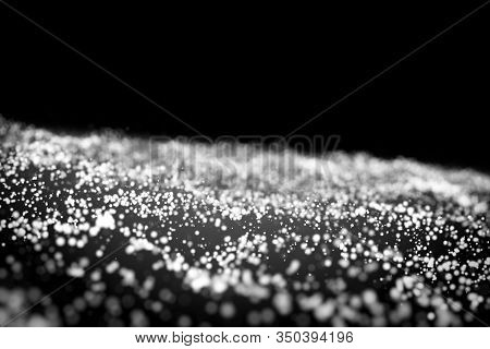Glow White Particles On Black Background