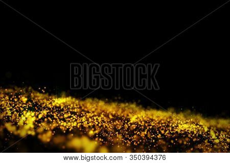 3D Rendering Glow Golden Particles On Black Background