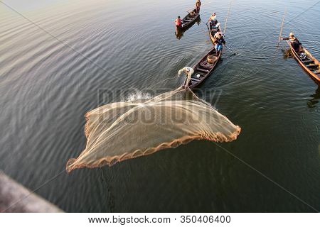 Mandalay, Myanmar - Nov 12, 2019: Fishermen Near U Bein Bridge In Amarapura,mandalay Myanmar