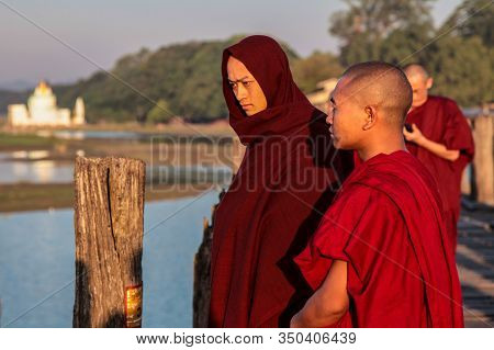 Mandalay, Myanmar - Nov 12, 2019: Monks At U Bein Bridge In Amarapura,mandalay Myanmar