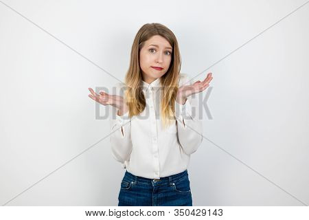 Young Beautiful Blond Woman Standing On Isolated White Background Looking Innocent , Body Language C