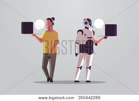 Robotic Operator With Man Consultant Using Laptop Chat Bubble Client Support Robot Vs Human Standing