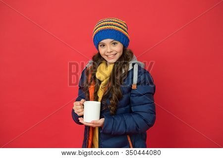 Time To Get Energy. Happy Child Enjoy Hot Drink On Winter Day. Small Girl Hold Tea Or Cocoa Cup Red 