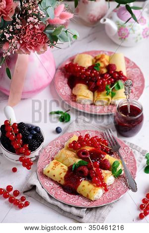 Crepes With Lemon Cream And Raspberry Jam..selective Focus. Style Vintage