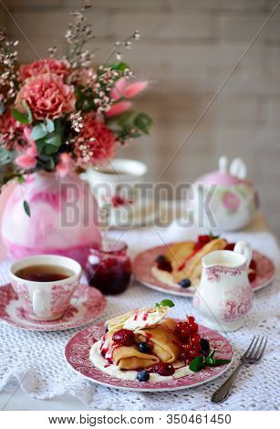 Crepes With Lemon Cream And Raspberry Jam..selective Focus. Style Vintage