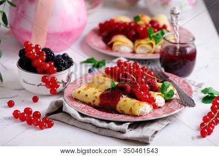 Crepes With Lemon Cream And Raspberry Jam..selective Focus. Style Vintage