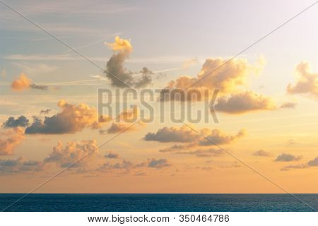 Sunset Over The Sea And Beautiful Cloud Landscape. Gold Sea Sunset Background.