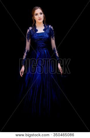 Close Up Portrait Of Beautiful Teen Girl In Beautiful Ultramarine Prom Dress Prom Dress. Black Backg