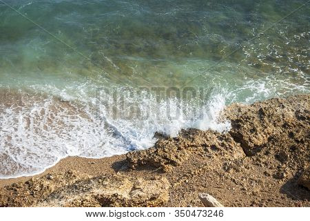 Waves Of The Sea Reaching The Shore Of The Beach