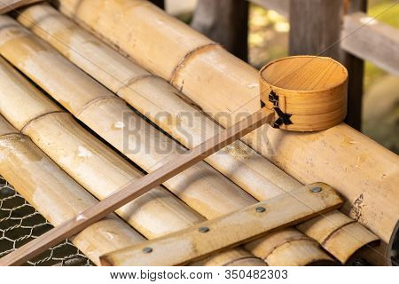 Purification Water Wooden Scoop In Japanese Shrine And Temple