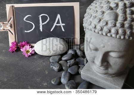 Buddha Head With Stones , Flowers And Tabular
