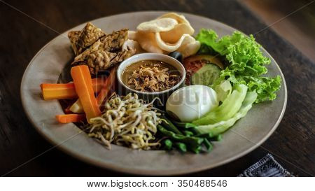 Peanuts, Peanut Butter, Sprouted Soybeans On A Plate In A Balinese Style. Gado-gado. Traditional Ind