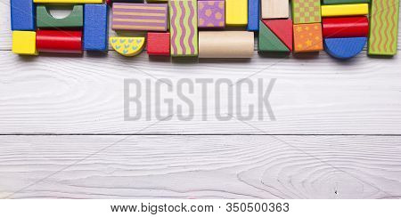 Kids Educational Developing Toys Frame On White Background. Top View. Flat Lay. Copy Space For Text