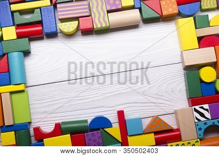 Kids Educational Developing Toys Frame On White Background. Top View. Flat Lay. Copy Space For Text