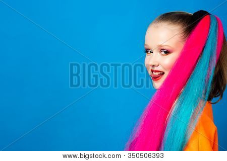Beautiful School Aged Girl With Long Colored Hair In Babershop. Rainbow Hairstyles. The Concept Of C