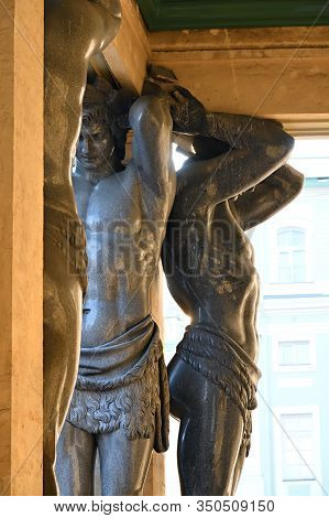 St Petersburg, Russia - January 31, 2020: Atlas (atlant) Granite Sculpture Of A Man Supporting Colum