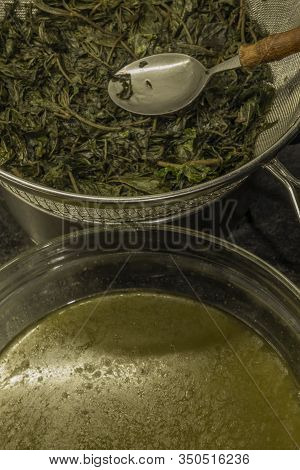 Making Of Marijuana Butter With Leafs And Yellow Butter Which Will Be Green