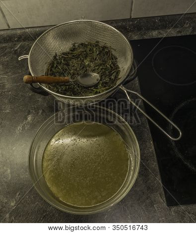 Making Of Marijuana Butter With Leafs And Yellow Butter Which Will Be Green