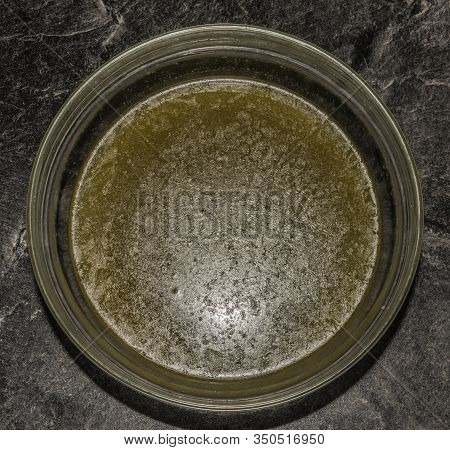Making Of Marijuana Butter With Leafs And Yellow Butter Which Will Be Green