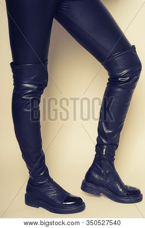 Slim Women's Legs In Black Leather Pants And Stylish High Boots