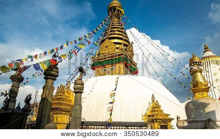 The Upper Part Of The Stupa In Buddhist Temple Swayambhunath In Kathmandu. The Image Of Buddhas Eyes