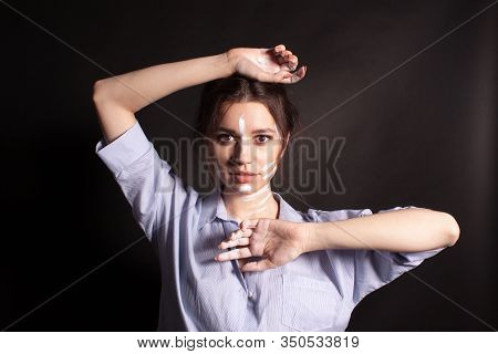 Fashion Beauty Portrait Of Beautiful Young Brunette Woman. White Paint On The Body And Face.