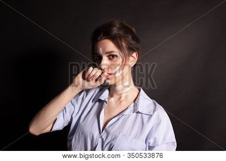 Fashion Beauty Portrait Of Beautiful Young Brunette Woman. White Paint On The Body And Face.