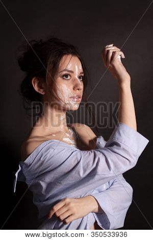 Fashion Beauty Portrait Of Beautiful Young Brunette Woman. White Paint On The Body And Face.