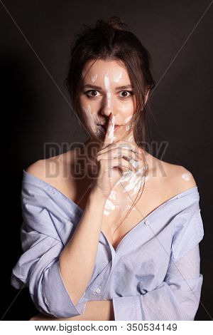 Fashion Beauty Portrait Of Beautiful Young Brunette Woman. White Paint On The Body And Face.