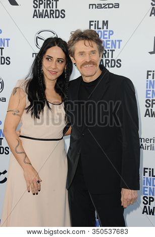 Giada Colagrande and Willem Dafoe at the 35th Annual Film Independent Spirit Awards held at the Santa Monica Beach in Santa Monica, USA on February 8, 2020.