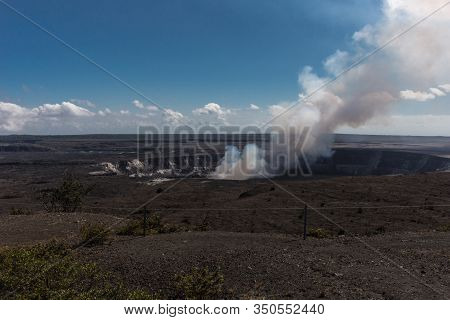 Kilauea Volcano, Hawaii, Usa. - January 9, 2012: View On Kalemaumau Crater Producing White-brown Thi