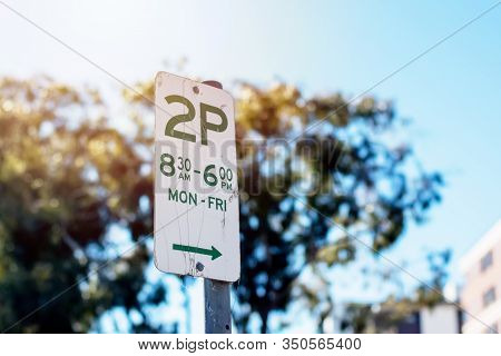 Street Parking Sign With Parking Rules Not To Park For More Than Two Hours - 2p - On Weekday Morning