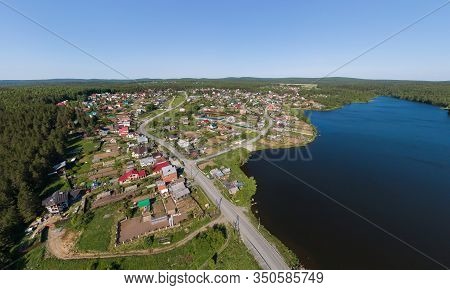 Aerial View Of Houses And Pond In Pervouralsk City. Summer