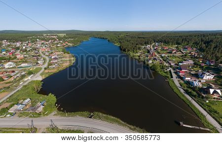 Aerial View Of Houses And Pond In Pervouralsk City. Summer