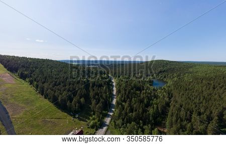 Aerial View Of Road Among Mountains And Forests In Pervouralsk City. Summer