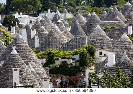 Alberobello, Italy - September 16, 2019: Tradtional White Houses In Trulli Village. Alberobello, Ita