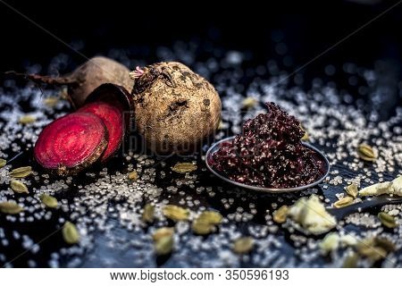 Close Up Of Fresh Beetroot Halwa Or Beet Ka Halwa In A Plate With Some Spread Sugar Crystals And Ela