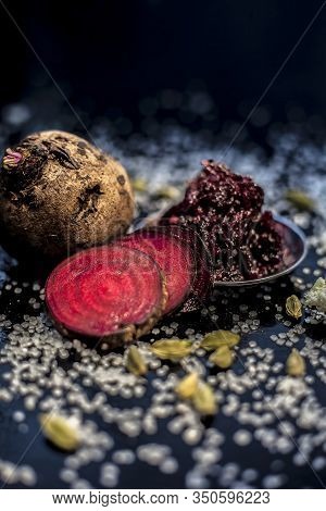 Close Up Of Fresh Beetroot Halwa Or Beet Ka Halwa In A Plate With Some Spread Sugar Crystals And Ela