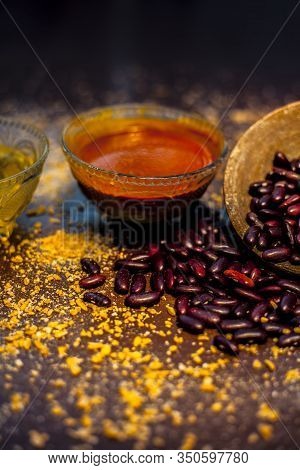 Home Pore Remedy On The Black Glossy Surface Consisting Of Some Red Beans Or Kidney Beans Mung Beans
