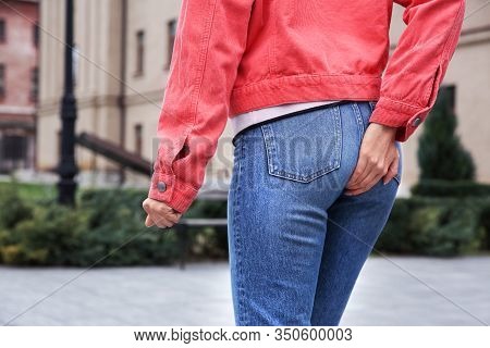 Woman Suffering From Hemorrhoid Pain Outdoors, Closeup